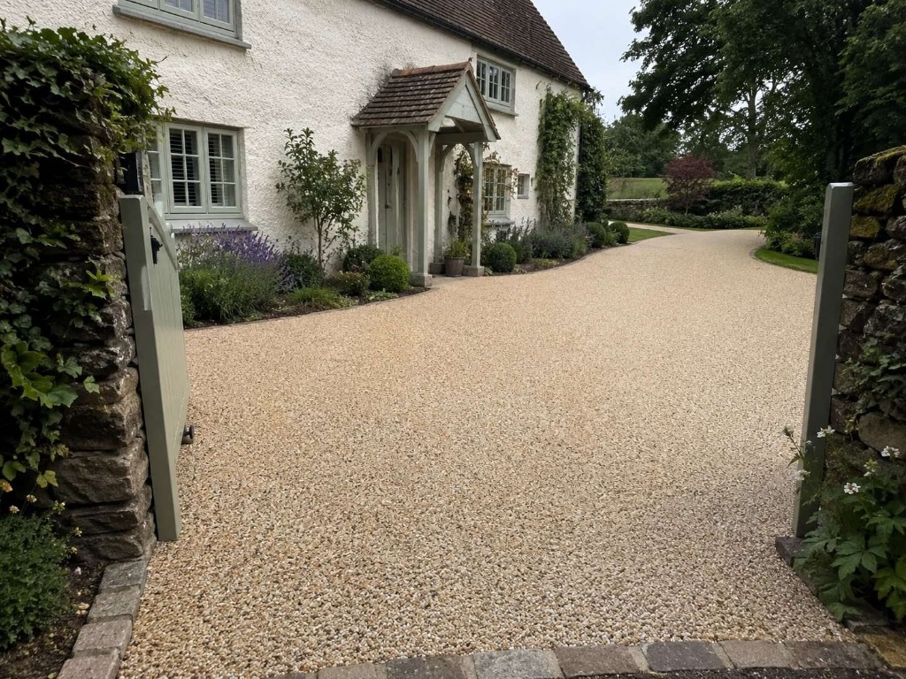 Caramel Latte resin bound long country driveway with cottage property by Daltex Resin Experts