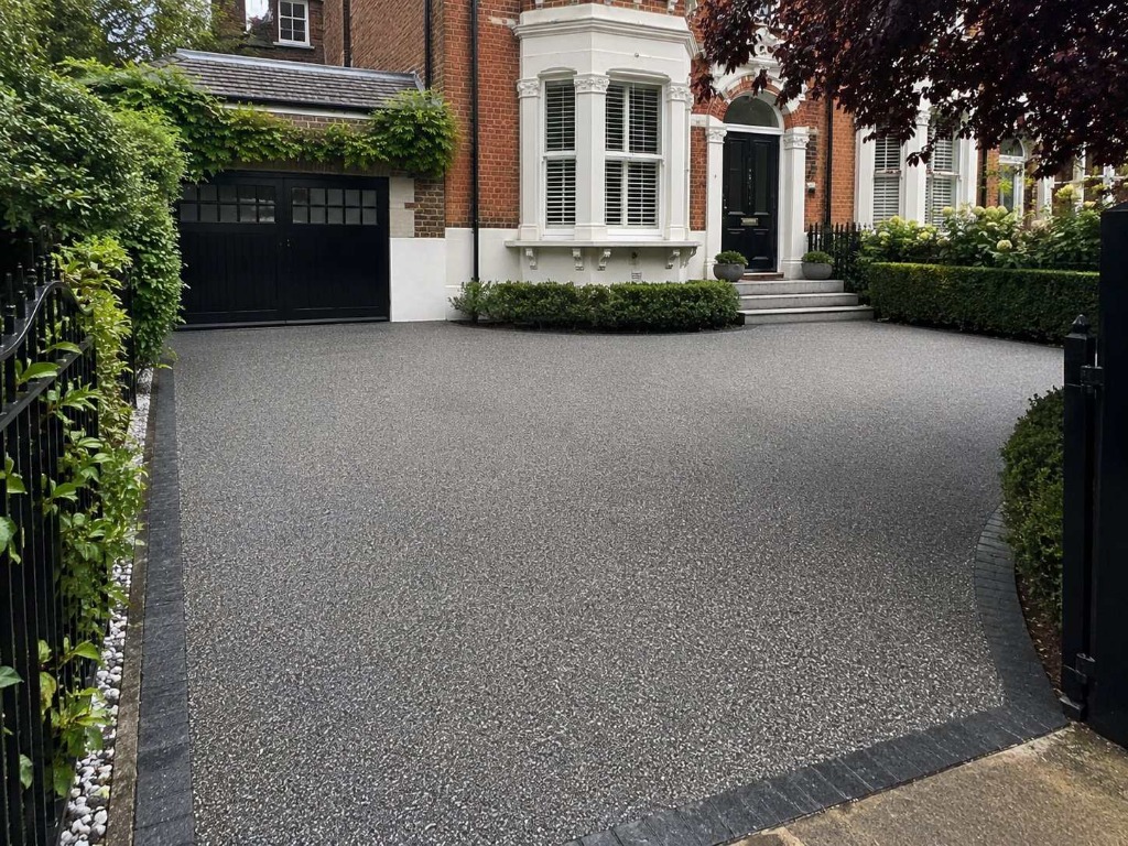 Dark Grey resin bound driveway on grand Victorian red brick London property by Daltex Resin Experts